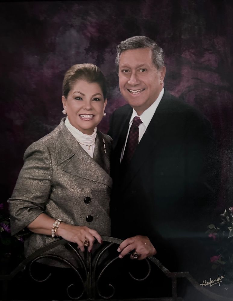 A person and person posing for a picture